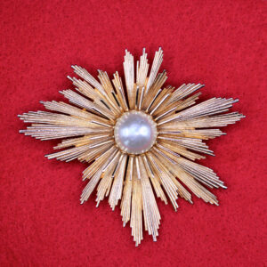 MCM Atomic-Age Starburst Brooch with Pearl Center.
